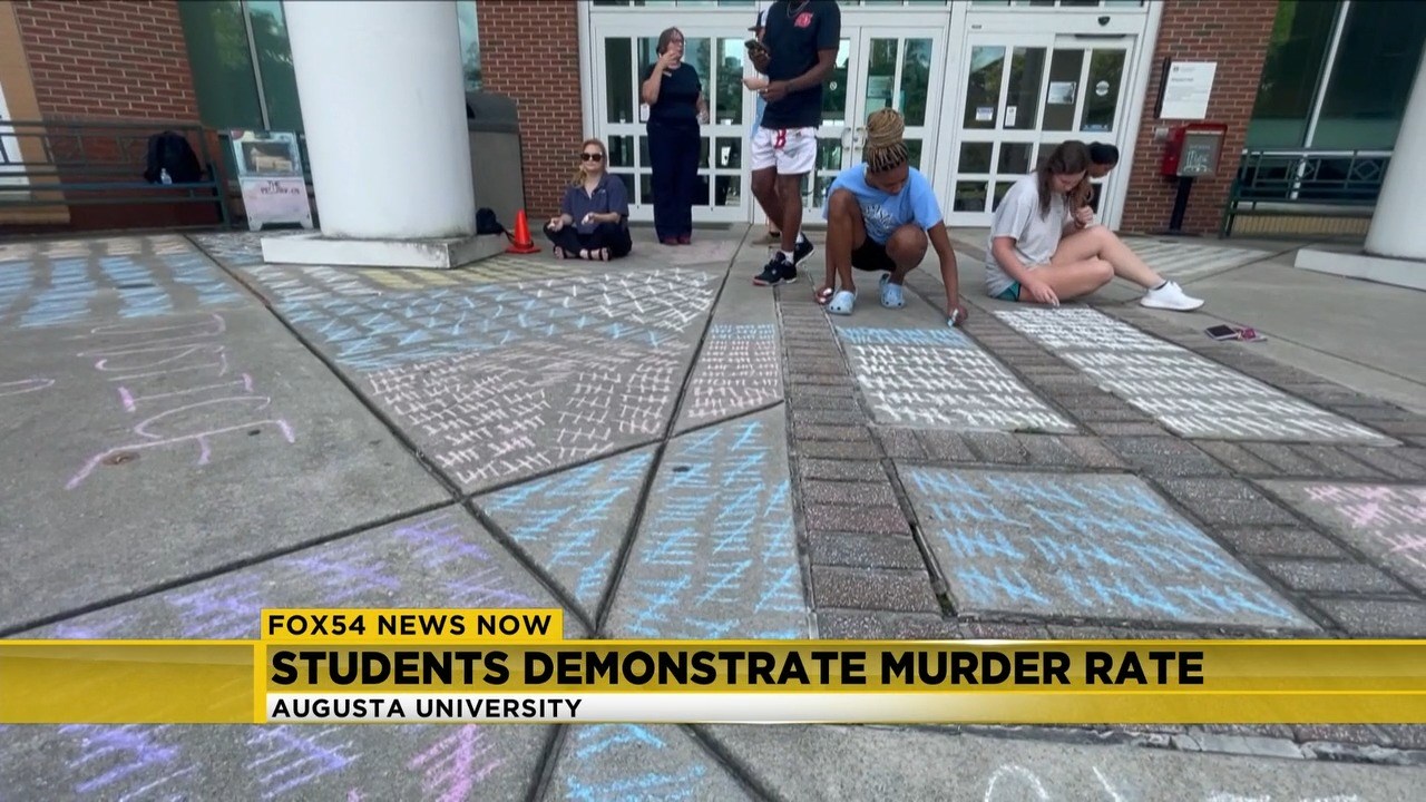 AU students raise awareness of crime statistics with sidewalk demonstration